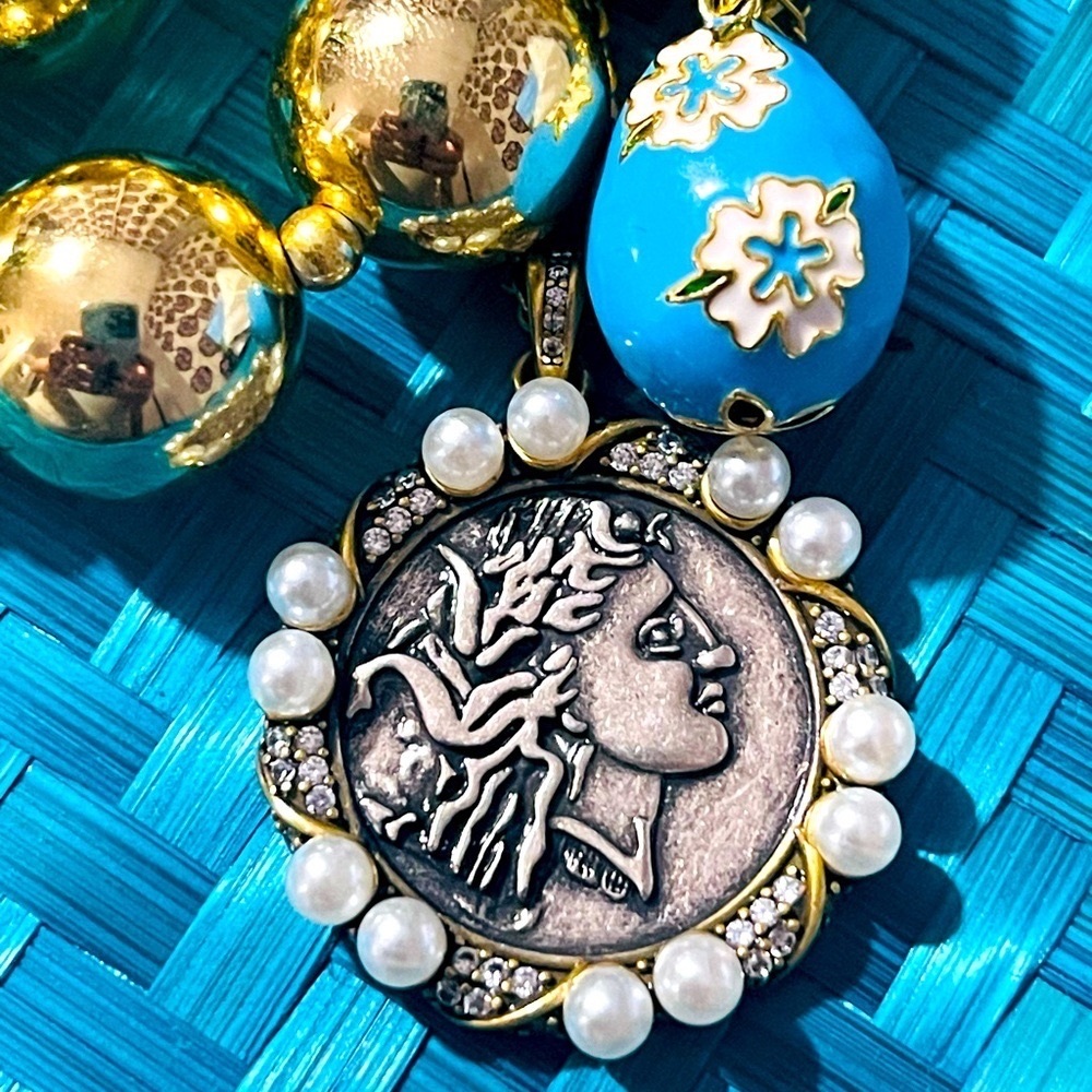 Stainless steel handmade gold necklace with a blue and white flowers charm. New